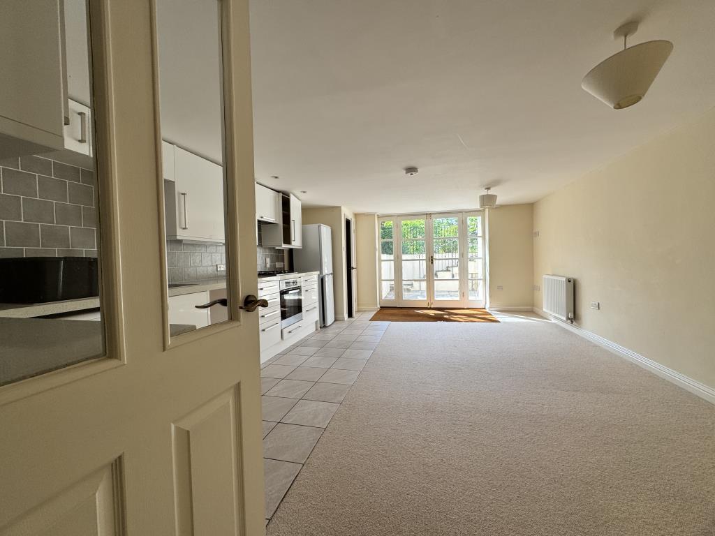 Lot: 138 - TWO-BEDROOM BUNGALOW WITH ANNEXE - Basement living/dining room and kitchen areas